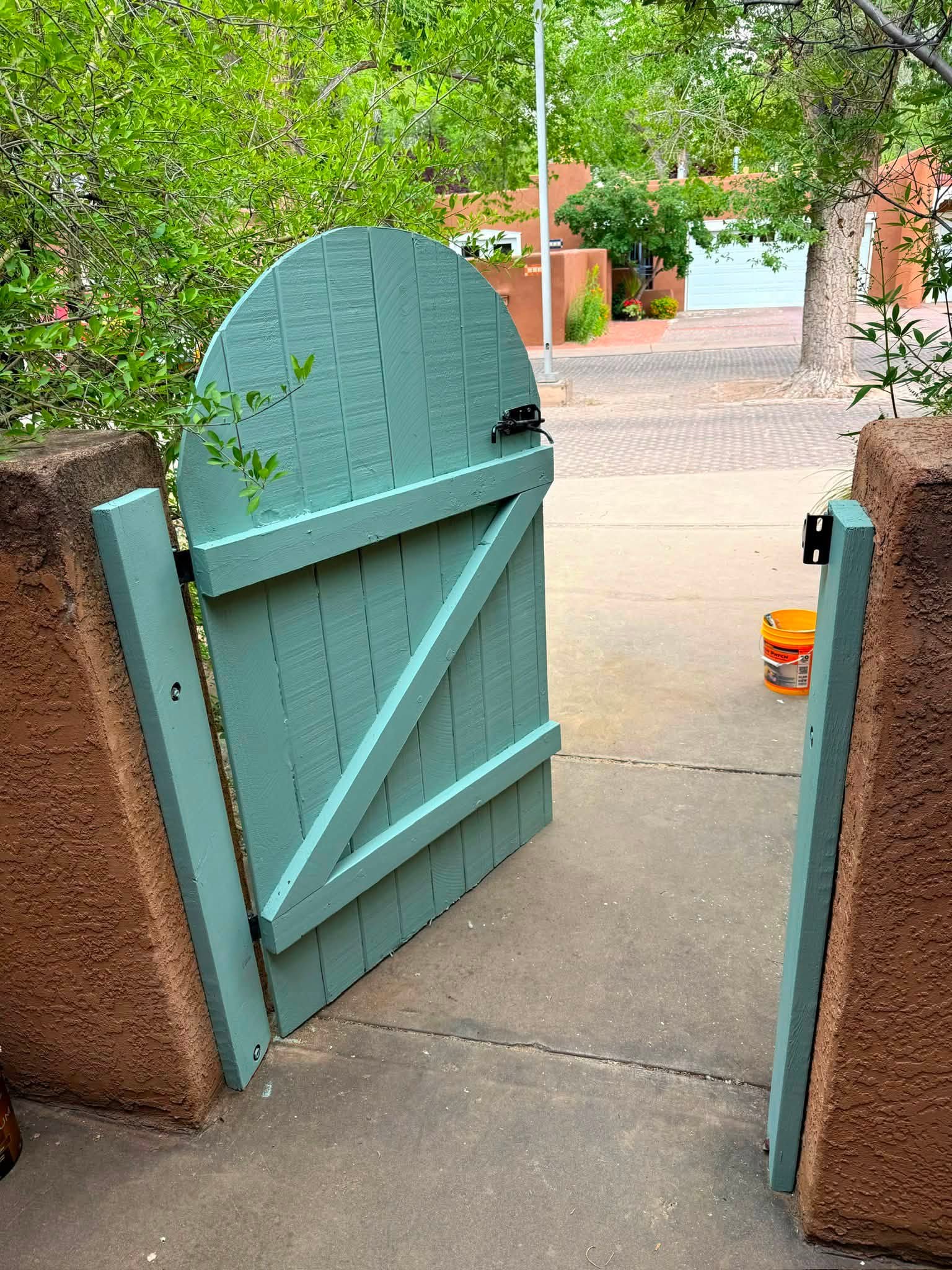 Turquoise painted wood gate from a Desert Stone project